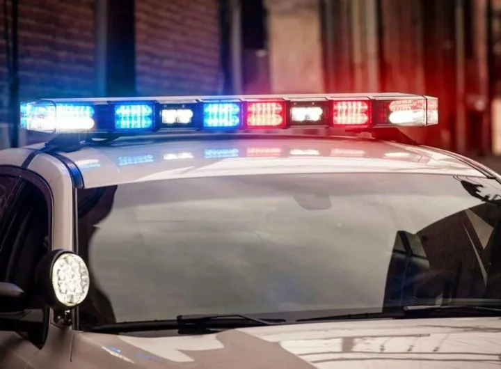 Police investigate a fatal crash scene near a stop sign and tractor-trailer in Foster, Rhode Island